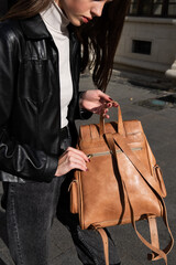 photo of a brown, retro look leather backpack
