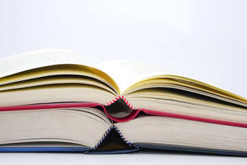Stack of open books and stacked together. Knowledge and education concept.