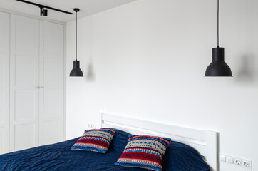 Black lamp on a white background. Modern and designer Scandinavian bedroom.