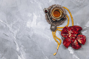 Stylish banner with traditional Arabic dishes and fresh cut juicy garnet. Ramadan table top view.