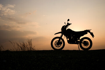 Fototapeta na wymiar silhouette of a bike. silhouette of a motorcycle. motorcycle on sunset. Silhouette Motocross Motorcycle