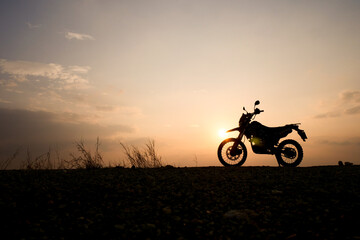 Fototapeta na wymiar silhouette of a bike. silhouette of a motorcycle. motorcycle on sunset. Silhouette Motocross Motorcycle