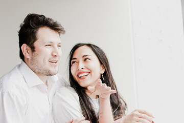 Photo of young couple enjoying, smiling, loving each other. Concept of lifestyle, human relations, love.