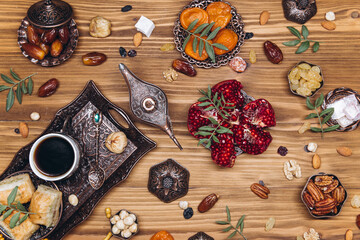 Ramadan table top view. Banner with traditional Arabic dishes, cup of coffee and food sets