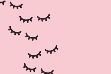 Paper eyelash pattern on pink background. Creative fashion concept.