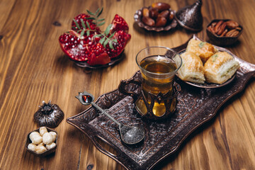 Ramadan table top view. Banner with traditional Arabic dishes, cup of tea and food sets