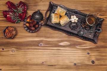 Ramadan table top view. Banner with traditional Arabic dishes, cup of tea and food sets