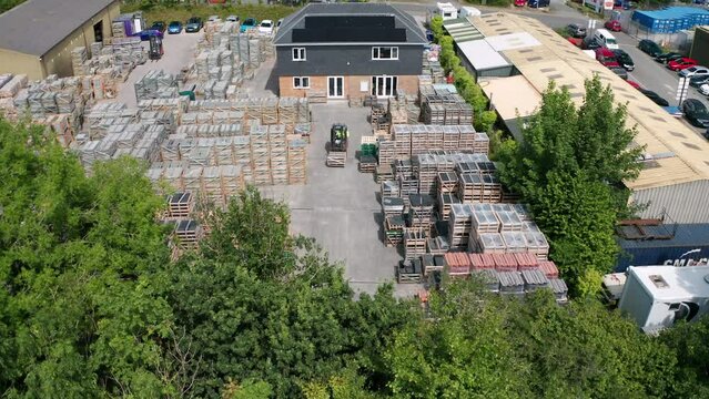 Solar panel commercial installation renewable energy at busy slate yard aerial