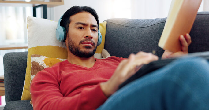 Man Entrepreneur Thinking, Inspiration And Writing Notes In A Book With Headphones On The Sofa In The Living Room. Student, Journalist And Creative Author With Idea, Planning And Strategy In Notebook