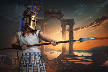 Fototapeta premium Art of greek female soldier with golden helmet and spear against sea and ancient columns.