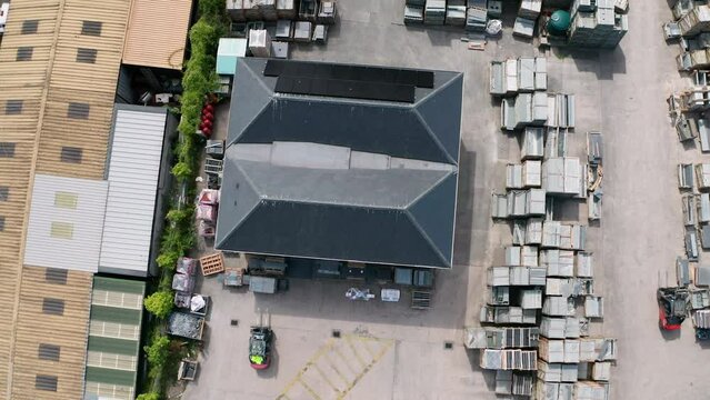 Commercial solar panel installation renewable energy at busy slate yard aerial