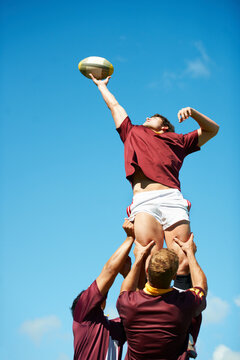 Capturing an epic moment. Shot of a young rugby player catching the ball during a lineout.