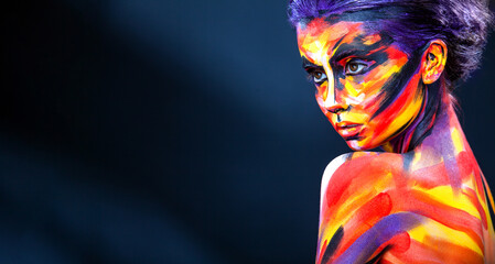 Woman in color body painting on her face. Horizontal banner. Cover art for your mixtape, video, song or podcast. Bodyart design for book covers.