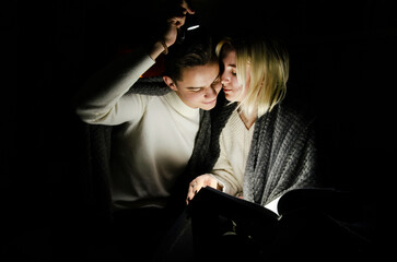 A couple in love at home during a power outage. Blackout, no electricity