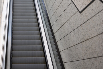 Obraz premium Escalators in an underground pedestrian passage. Underground urban infrastructure for pedestrian traffic