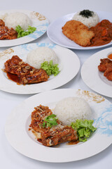set of various plates of food, deep-fried chicken, and deep-fried pork isolated on white background, top view.