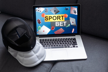 fencing, sports betting on a laptop