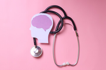 Brain paper cutout with stethoscope for autism, stroke, epilepsy and alzheimer awareness. Seizure...