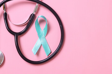 Teal awareness ribbon with stethoscope for Ovarian Cancer month, cervical cancer, Polycystic Ovary...