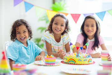 Kids birthday party. Children with cake and gifts