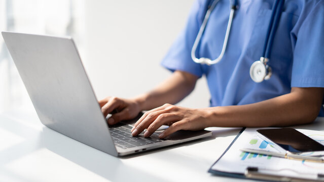 Female doctor consulting patient online from clinic office. Giving medical prescriptions by internet.