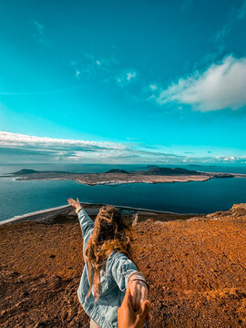 Woman looking at Island Graciosa from Lanzarote