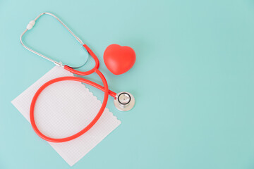 Red heart and paper with doctor physician's stethoscope, World heart health day, doctor day.