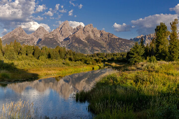 Fototapeta na wymiar Tetons Refelcted in a Quiet Stretch of the Snake River