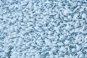Ice crystals close up. Macro photo of a frozen surface.