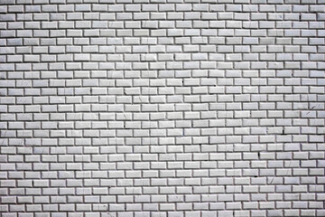 Fototapeta na wymiar Texture of small white tiles with black grout.