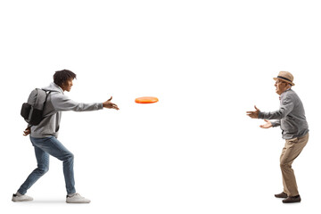 Full length profile shot of a young african american man playing a flying disc to an elderly man