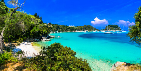 Fototapeta na wymiar Ionian islands of Greece. splendid island Paxos. Beautiful turquoise bay and beach in Lakka village. greek summer destinations