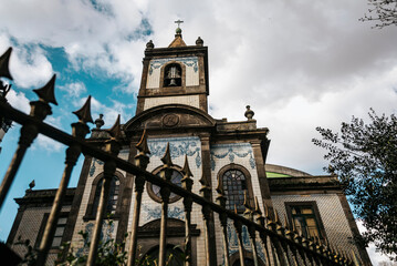 Bottom view of details of gate and church facade, Porto, Portugal,