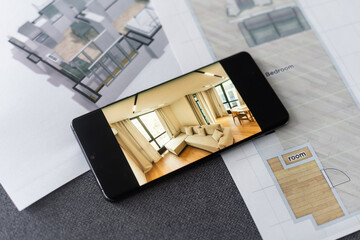 website wireframe sketch and programming code on smartphone
