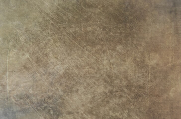 Abstract background is distressed, with a dark cream color and a grungy texture. This background can be used as a backdrop for graphic designs with a traditional concept.