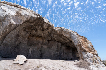 Cave in Namaqua National Park South Africa with blue sky and white clouds in the back ground