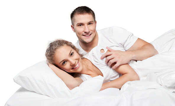 Young Couple In Bed Isolated On White Background