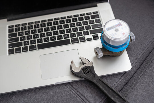 water meter and laptop background
