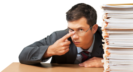 Portrait of a Serious Employee Behind a Stack of Folders