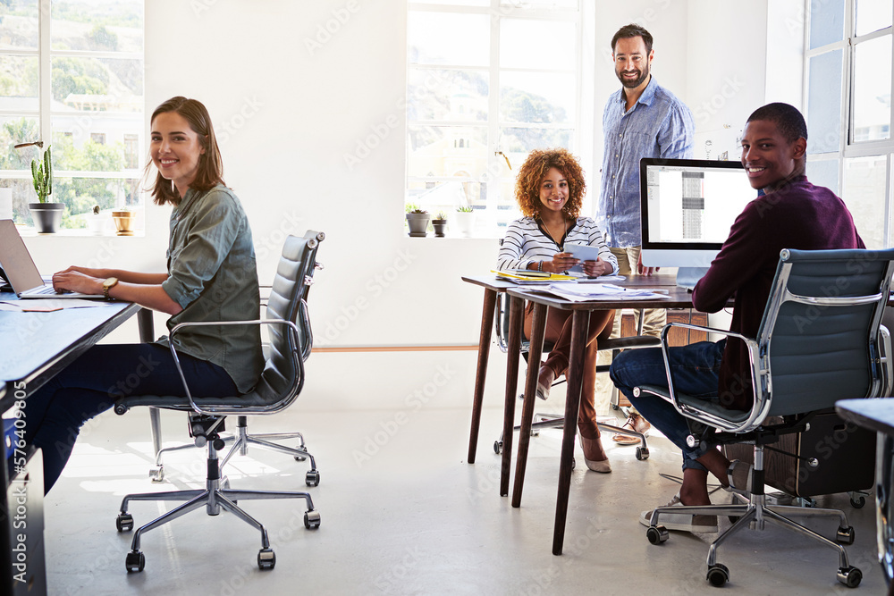Aufkleber our office layout improves productivity. portrait of a team of colleagues working in an open plan of