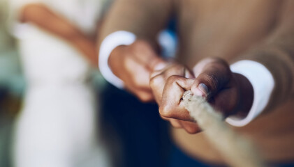 Its hard to beat someone who never gives up. Cropped shot of corporate businesspeople pulling on a rope during tug of war.