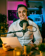 man shooting or streaming video podcast or vlogg blogger at studio