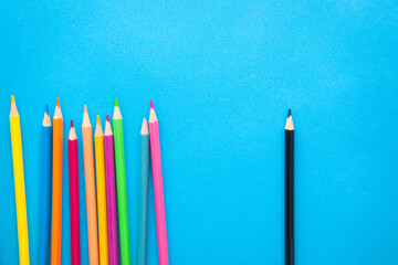 Group of pencils versus one, vibrant color card with originality and uniqueness concept