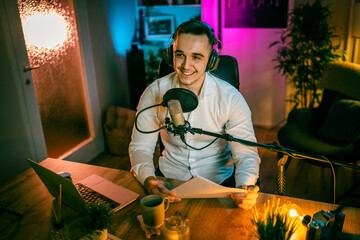 man shooting or streaming video podcast or vlogg blogger at studio