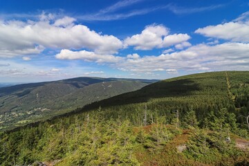 A view to the landscape during sunny day from the large stones called Poledni kameny near Hejnice, Czech republic