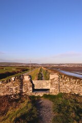 Stone gate on country coastal path