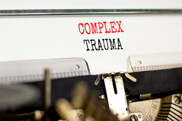 Complex trauma symbol. Concept words Complex trauma typed on white paper on old retro typewriter....