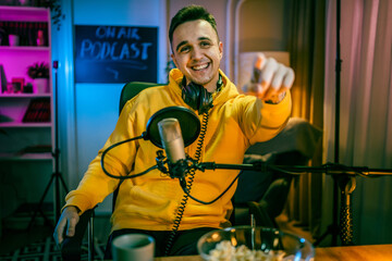 man shooting or streaming video podcast or vlogg blogger at studio