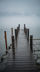 wooden pier in the lake, fog time