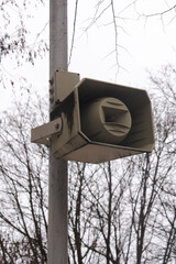 Speaker on a pole in the park